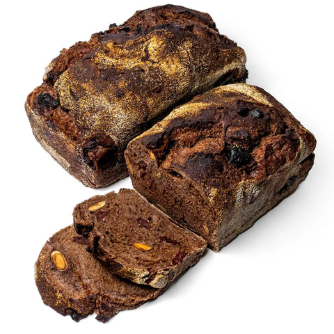 Loaves of dark brown chocolate bread with almonds
