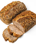 Loaf of whole grain Domaselo sourdough with sunflower, sesame, and flax seeds