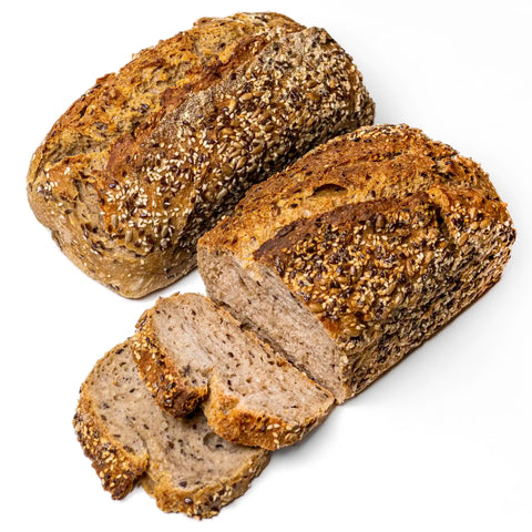 Loaf of whole grain Domaselo sourdough with sunflower, sesame, and flax seeds